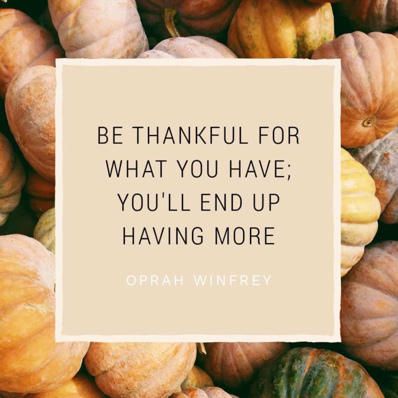 Quote graphic: Be Thankful for what you have; you'll end up having more - Oprah Winfrey. Background image of stack of Pumpkins.
